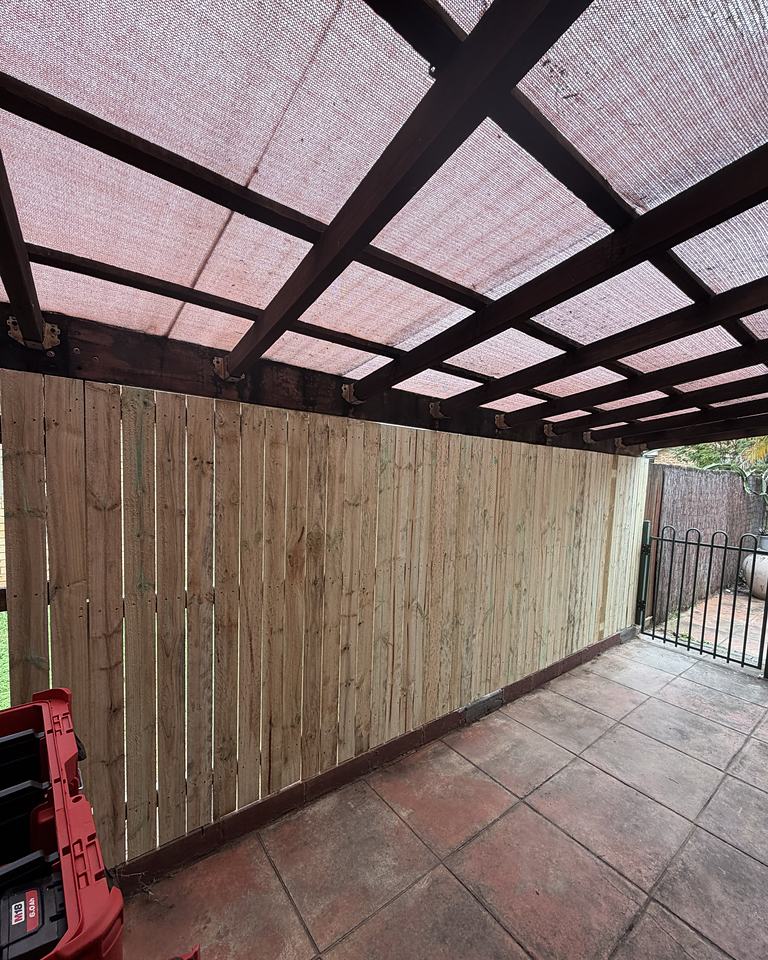 Timber slat privacy screen built into an existing patio
