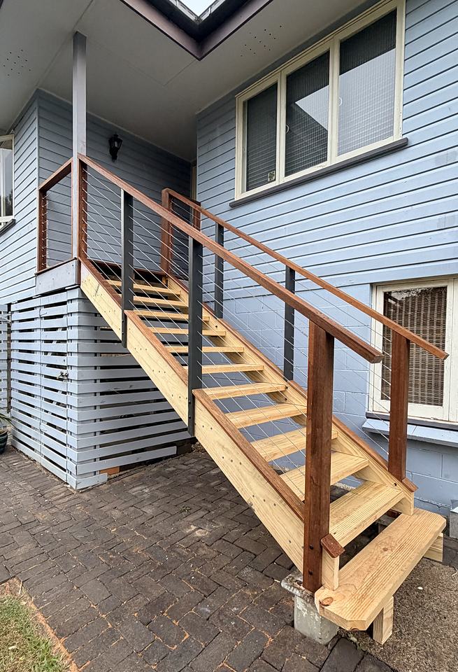 Timber stair with hardwood handrail and wire balustrade